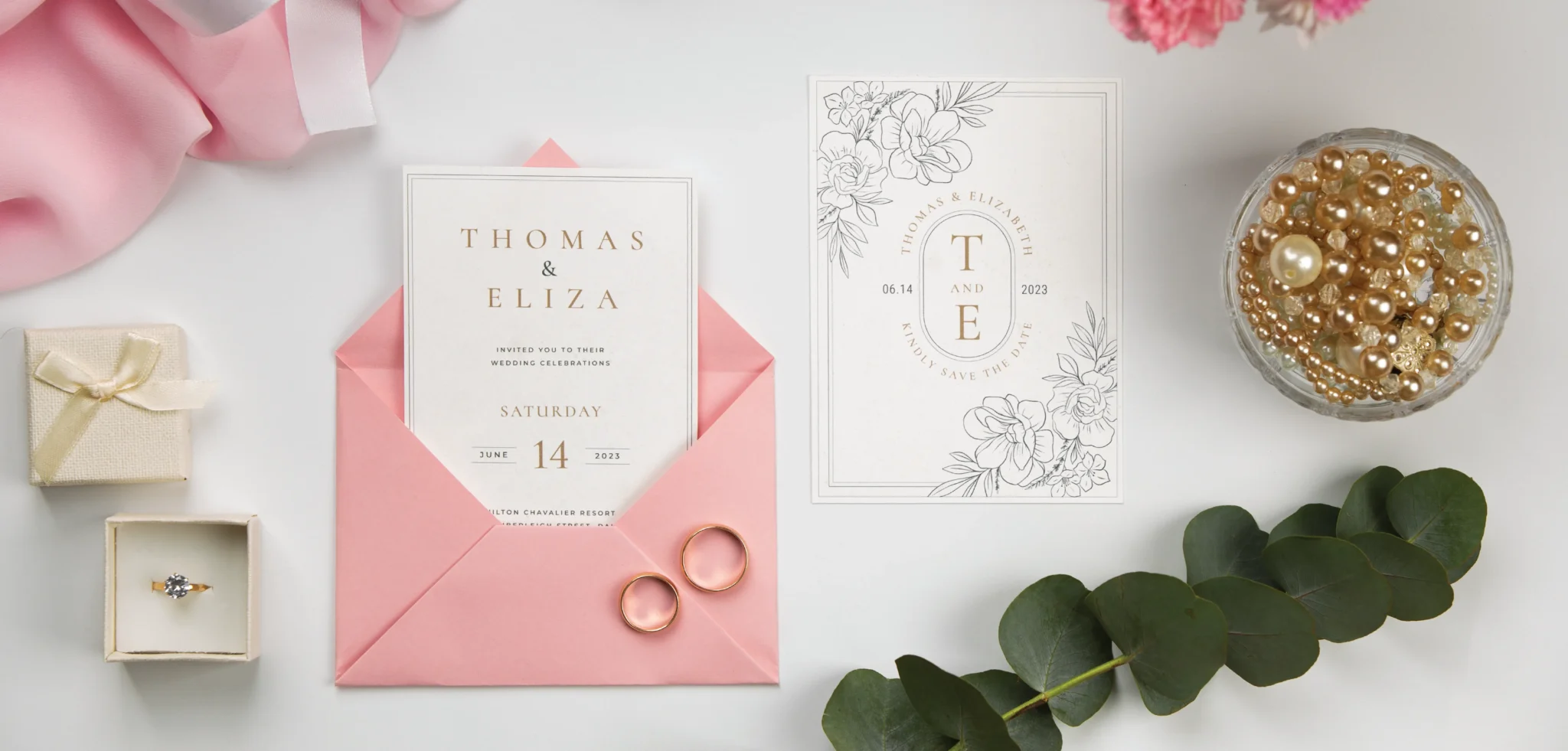 A wedding invitation with floral illustrations in a pink envelope