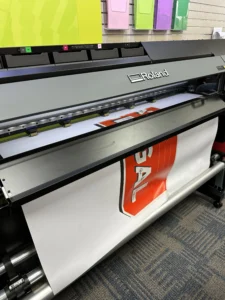 Large format banner being printed on a wide format printer